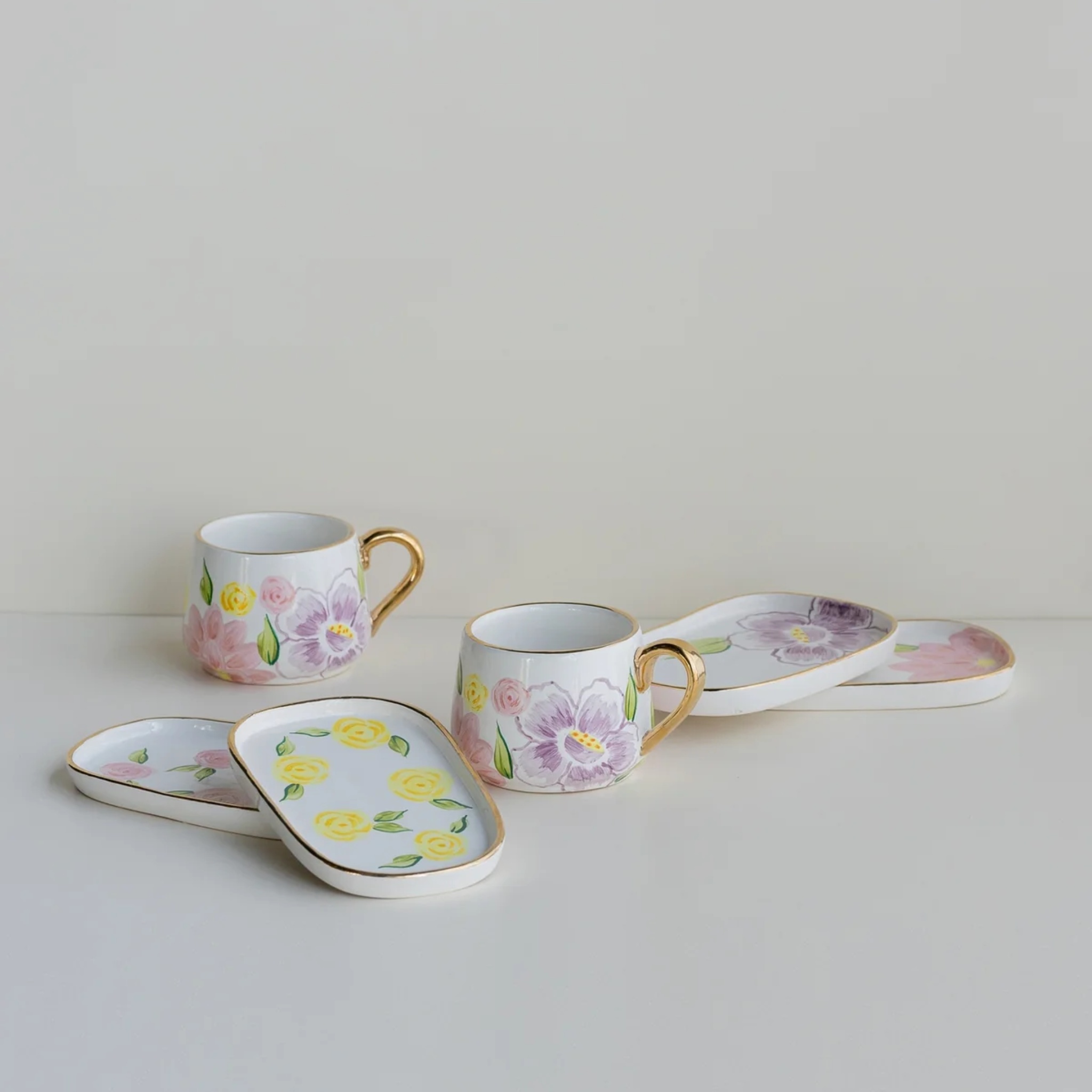 pink lilies oval plates (set of 4) by nira's ceramics | Tooffi